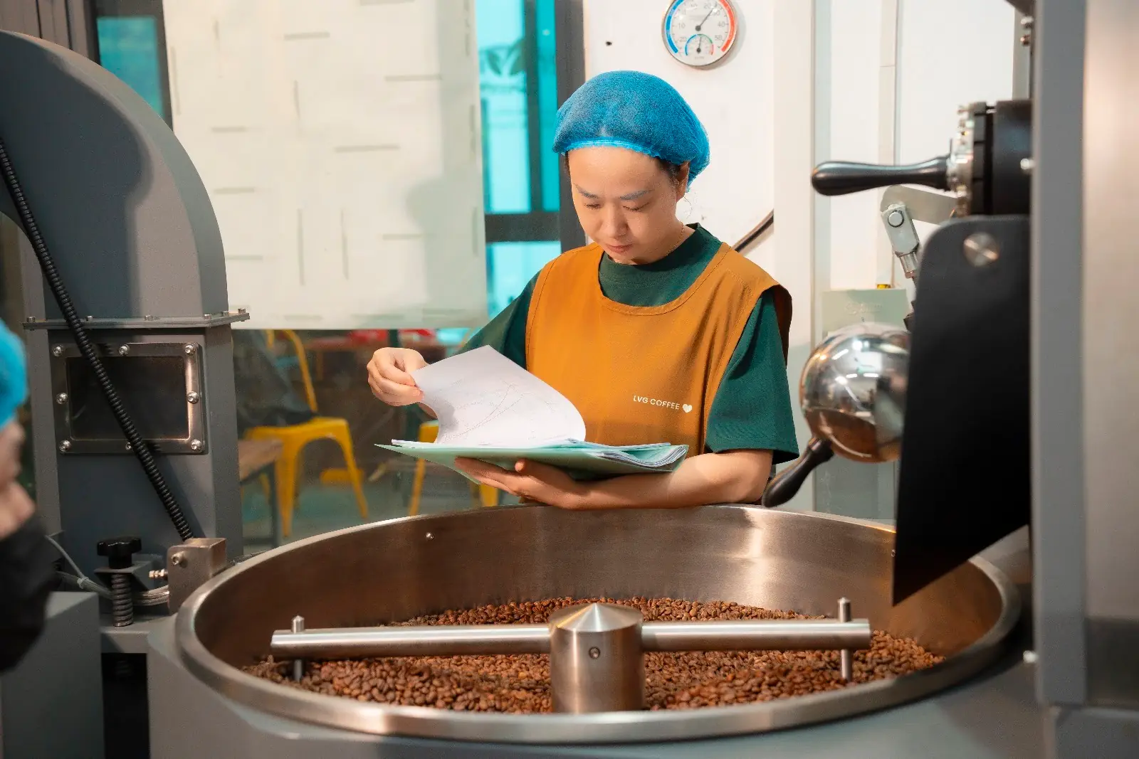 Operating the roaster at the roastery