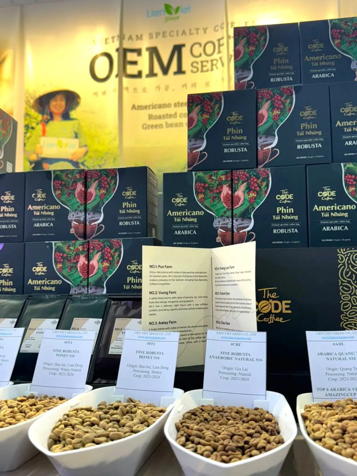 The Code Coffee drip bag boxes and green bean samples at Cafe Show booth