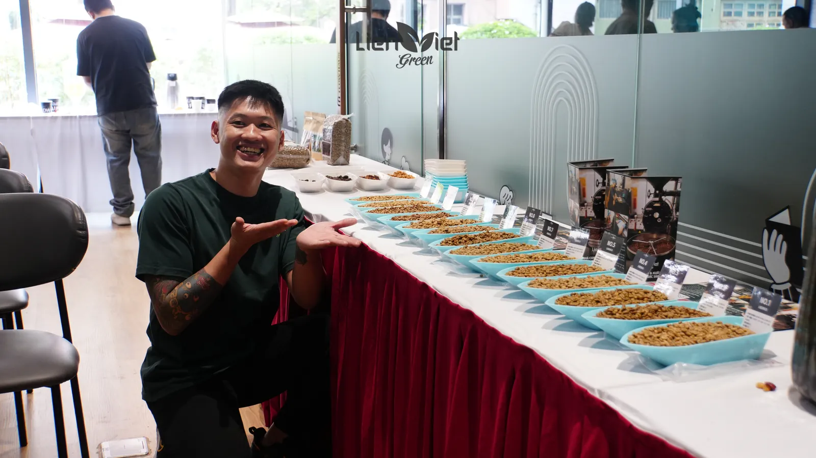 LVG staff presenting trays of green coffee samples