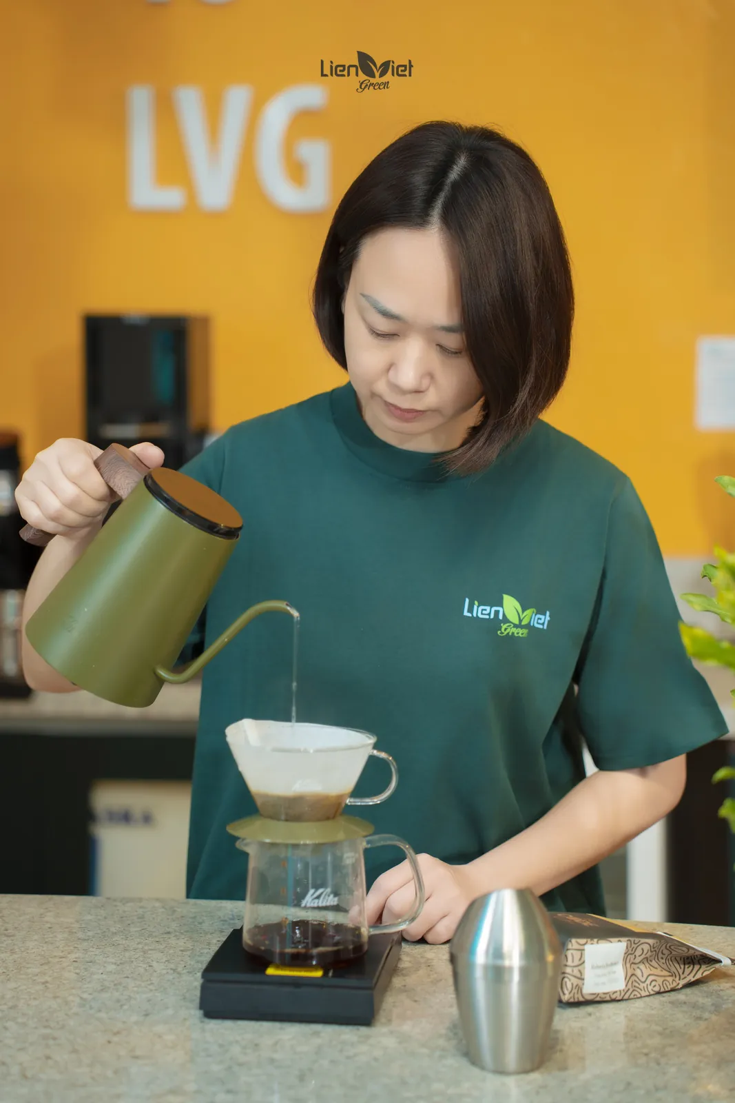 Ms Huong (Mayer Chan) brewing pour-over at Lien Viet Green Coffee House