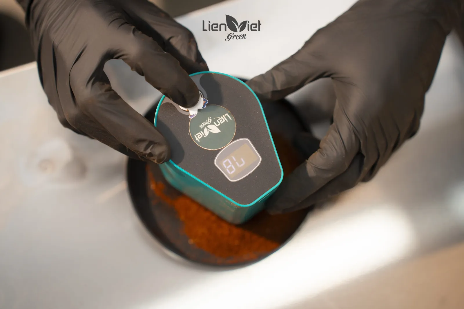 Measuring the roast colour of ground coffee with a colour meter at Lien Viet Green