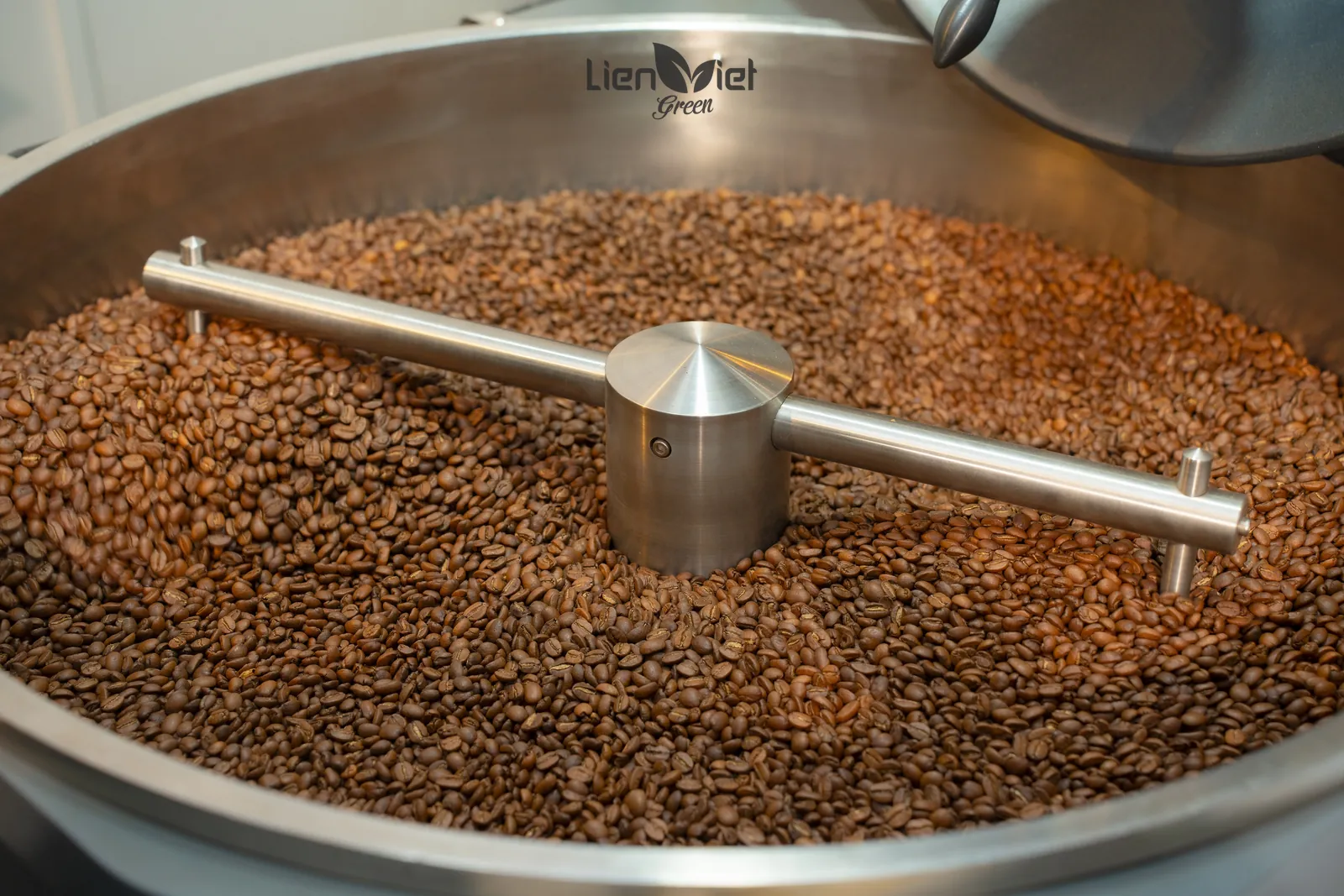 Freshly roasted beans turning in the roaster's cooling tray